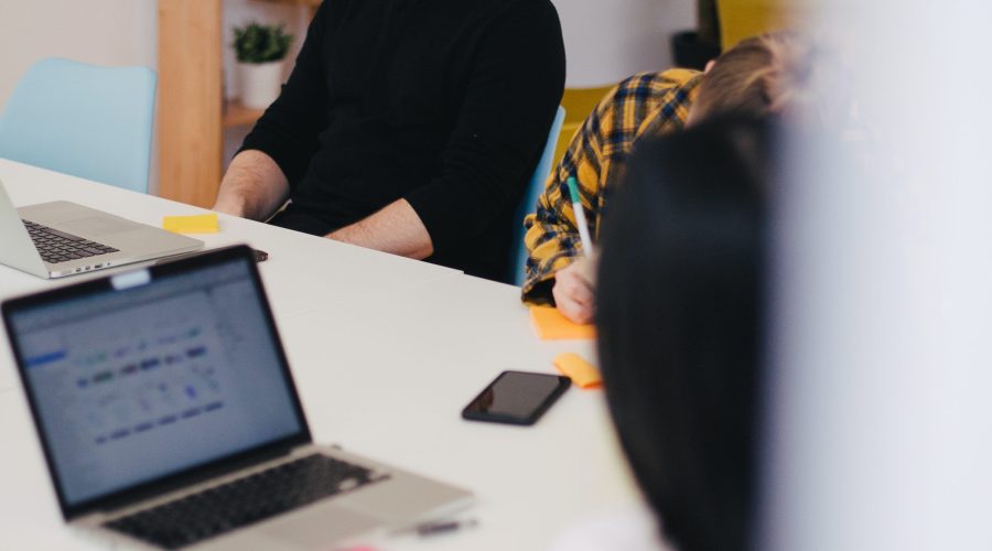 A man and woman are sitting at a table talking