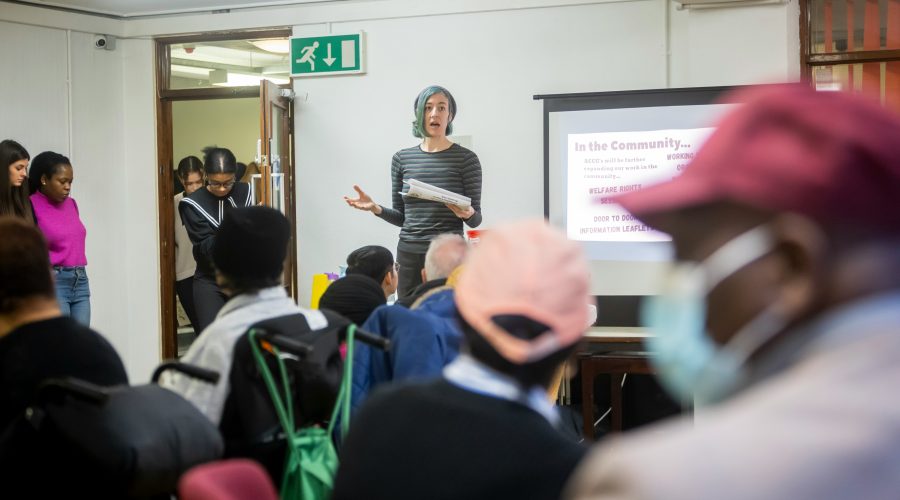 Ways to Create Social Impact in Your Community and Why It Matters A woman is standing in front of a classroom with adults and talking