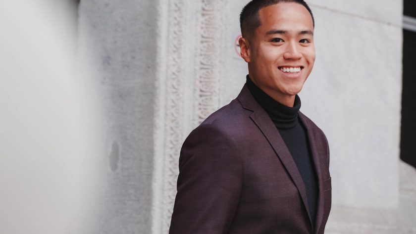 Coaching - The Leadership Skill That Grows People and Results An African American man is standing and smiling