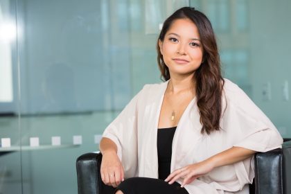 A woman is sitting in a chair