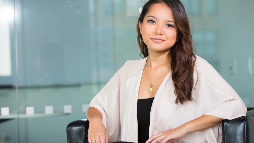 A woman is sitting in a chair