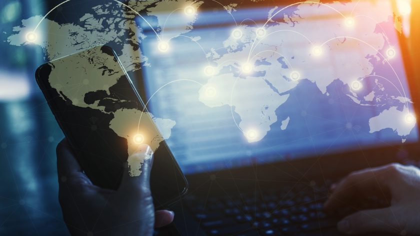 Pros and Cons of AI in Coaching A digital image of parts of the world with data flowing