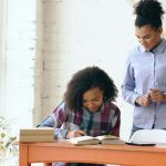 Unlock Your Potential - Coach Training is the Game-Changer 2 African American woman are talking
