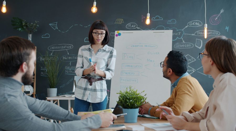 About Coaching Training in the Center for Coaching Certification Level 1 and 2 Programs A group of men and woman are sitting in classroom or conference room and talking or training