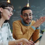 A man and a woman are sitting and talking