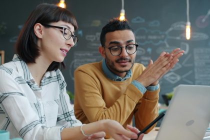 A man and a woman are sitting and talking