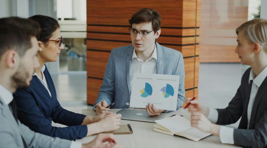Ethics, Competencies, and PCC Markers Provide the Foundation A group of business men and woman re sitting round a conference table