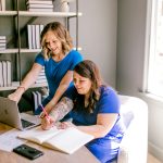 2 Woman are in an office and talking
